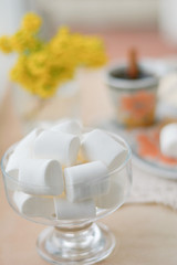 Fototapeta na wymiar marshmallows, candies in glass bowl 