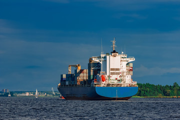 Blue container ship underway
