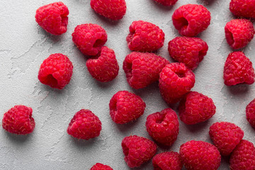 Fresh raspberry on light grey background, overhead view