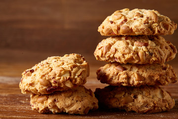 Bunch of chocolate biscuits on a rustic wooden background, close-up, selective focus.