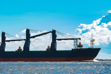Blue cargo ship underway