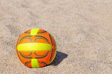 ball lying on the beach sand