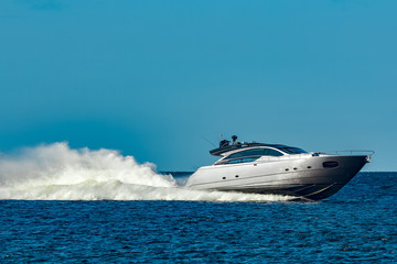 Grey motor yacht in move