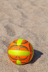 ball lying on the beach sand