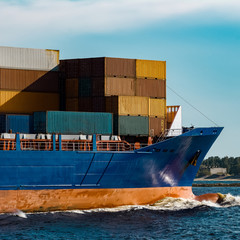 Blue container ship underway