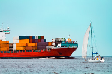 Fototapeta premium Red container ship underway