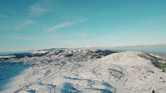 Drone flight in snowy mountains of Greece. Locations - Ziria Ski Center. Multiple moves and shots. Great view.