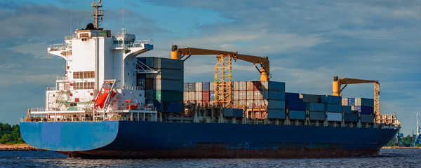 Blue container ship underway