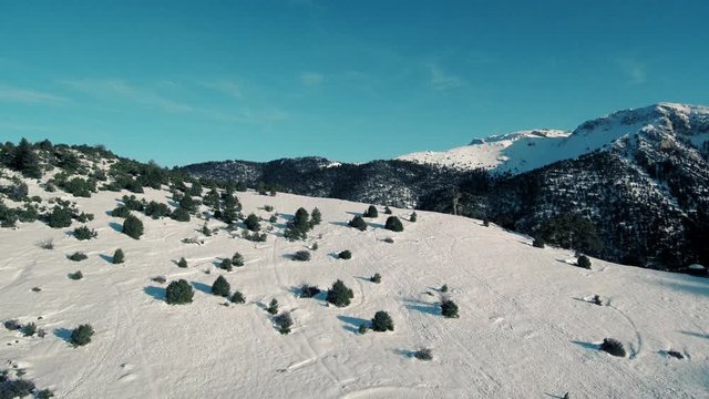 Drone flight in snowy mountains of Greece. Locations - Ziria Ski Center. Multiple moves and shots. Great view.