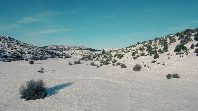 Drone flight in snowy mountains of Greece. Locations - Ziria Ski Center. Multiple moves and shots. Great view.