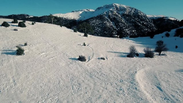 Drone flight in snowy mountains of Greece. Locations - Ziria Ski Center. Multiple moves and shots. Great view.