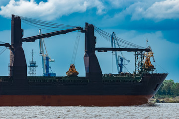 Blue cargo ship underway