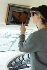 Woman on cruise boat working the navigation system
