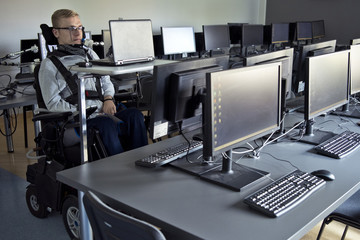 Disabled student in class room.