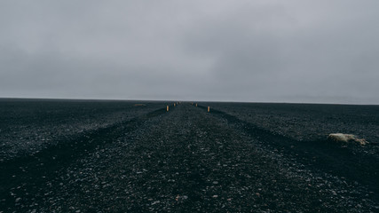 black rock path with no people in iceland lonely