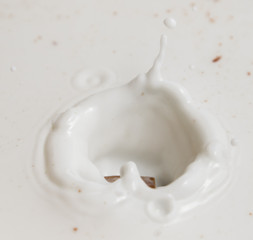 Fototapeta na wymiar Chocolate falls in milk