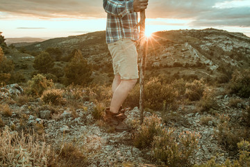 Cowboy in the mountains and a sunset