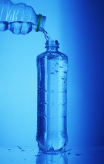 pouring water into the bottle