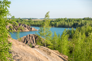 Photo of mountainous area with green trees and river