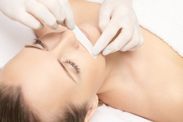 Fototapeta na wymiar Sugar hair removal from woman body. Wax epilation spa procedure. Procedure beautician female. Mustache