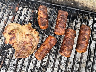 Pork and kebab on the barbeque /bbq/ barbecue grill.