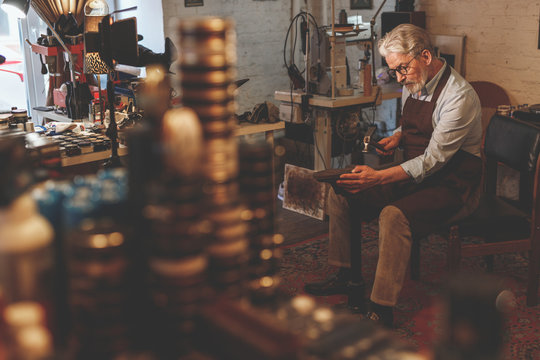 An elderly man at work