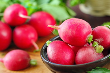 Fresh radishes on wooden table