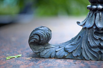 Metal artistic forging pedestal detail on a leaf-shaped style
