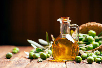 Bottle of oilve oil on wooden table