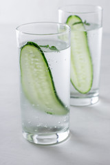 Refreshing water with a cucumber in a glass