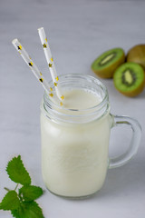 Smoothies with kiwi in a glass jar for lunch