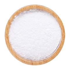 White rice flour powder in wooden bowl isolated on white. Top view.