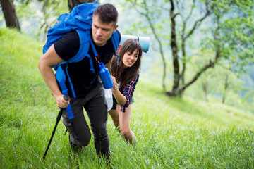 Fototapeta premium Couple enjoying on their hiking trip.Travel and adventure concept