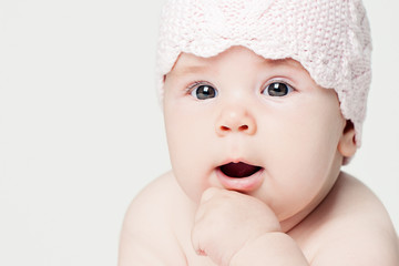 Baby face closeup portrait on white banner background with copy space