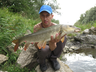 Coarse fishing for barbel in river