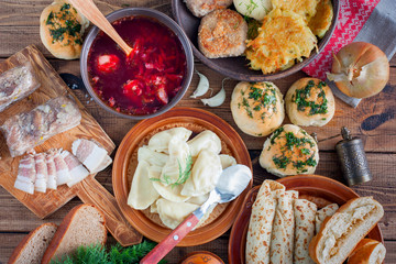 Covered table with traditional Ukrainian food, top view, horizontal