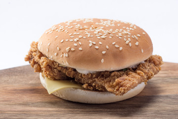 Crispy chicken burger with lettuce, cheese, and mayonnaise
