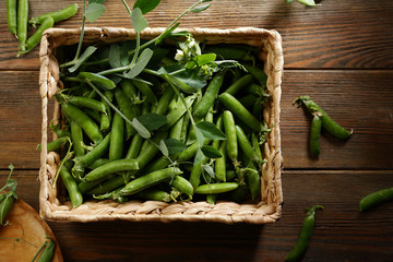 Harvest of organic green peas in crate