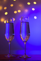 Champagne glasses in disco party bar