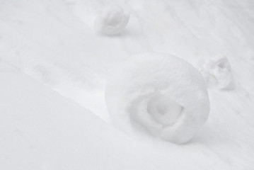 Pure snow drift ball rolling down from hill, snowball in blizzard weather, snowdrift