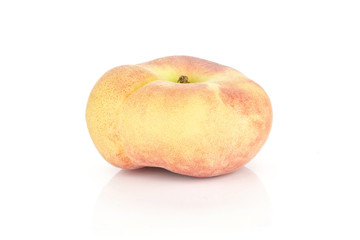 One fresh ripe Saturn peach isolated on white background.