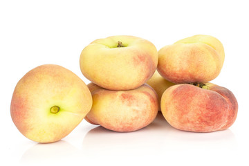 Fresh Saturn peaches stack isolated on white background ripe fruits.