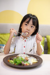 Asian Little Chinese Girl Eating Western Food