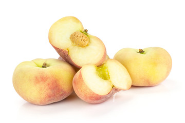 Fresh ripe Saturn peaches and two sliced halves isolated on white background.