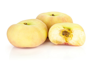 Naklejka na ściany i meble Two fresh ripe Saturn peaches with one half isolated on white background.