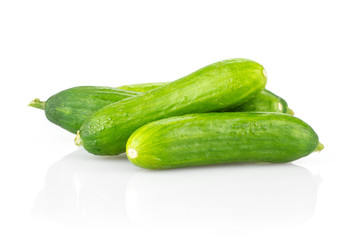 Three fresh green mini cucumbers set isolated on white background.