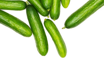 Fresh mini cucumbers top view isolated on white background.