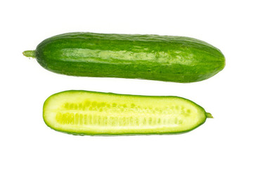 Fresh mini cucumber and one section half flatlay isolated on white background.