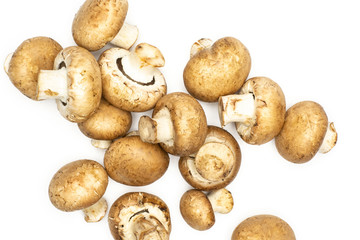 Fresh raw brown champignons flatlay isolated on white background.