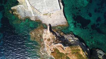 Aerial drone bird's eye view of iconic and picturesque Andros island chora, Cyclades, Greece